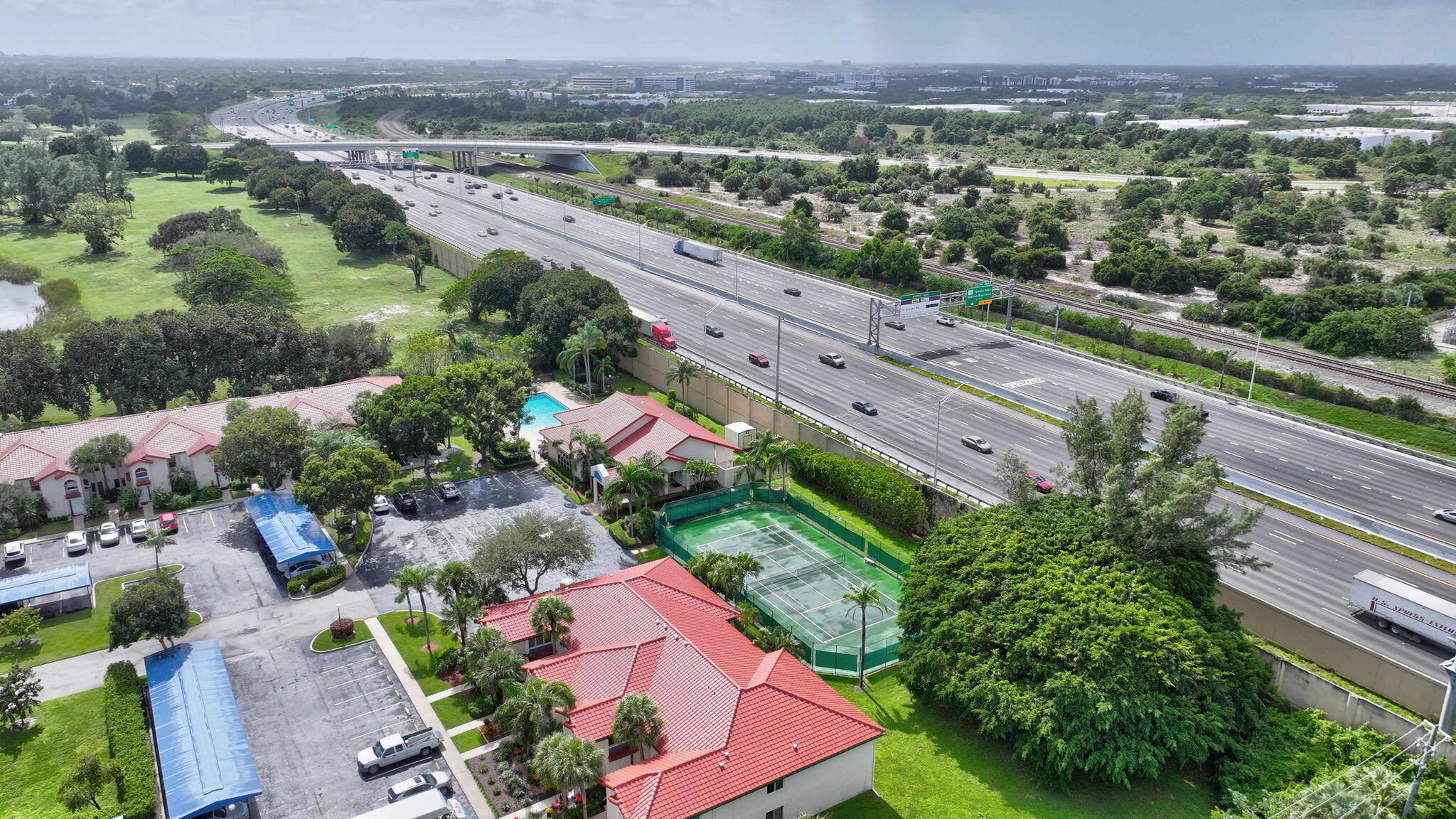 320 Northwest 67th Street, Unit C207 Boca Raton, FL 33487 - Photo 36 of 39 an aerial view of a city with lots of residential buildings