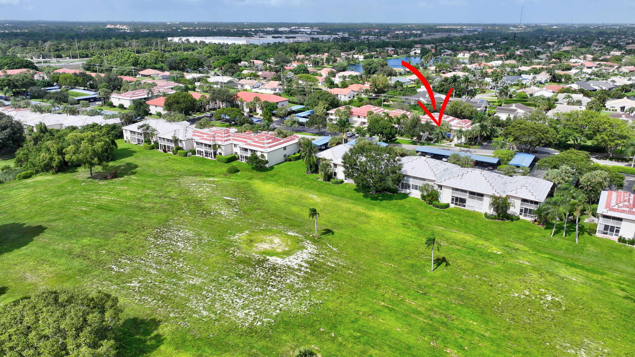 320 Northwest 67th Street, Unit C207 Boca Raton, FL 33487 - Photo 39 of 39 an aerial view of residential houses with outdoor space and trees