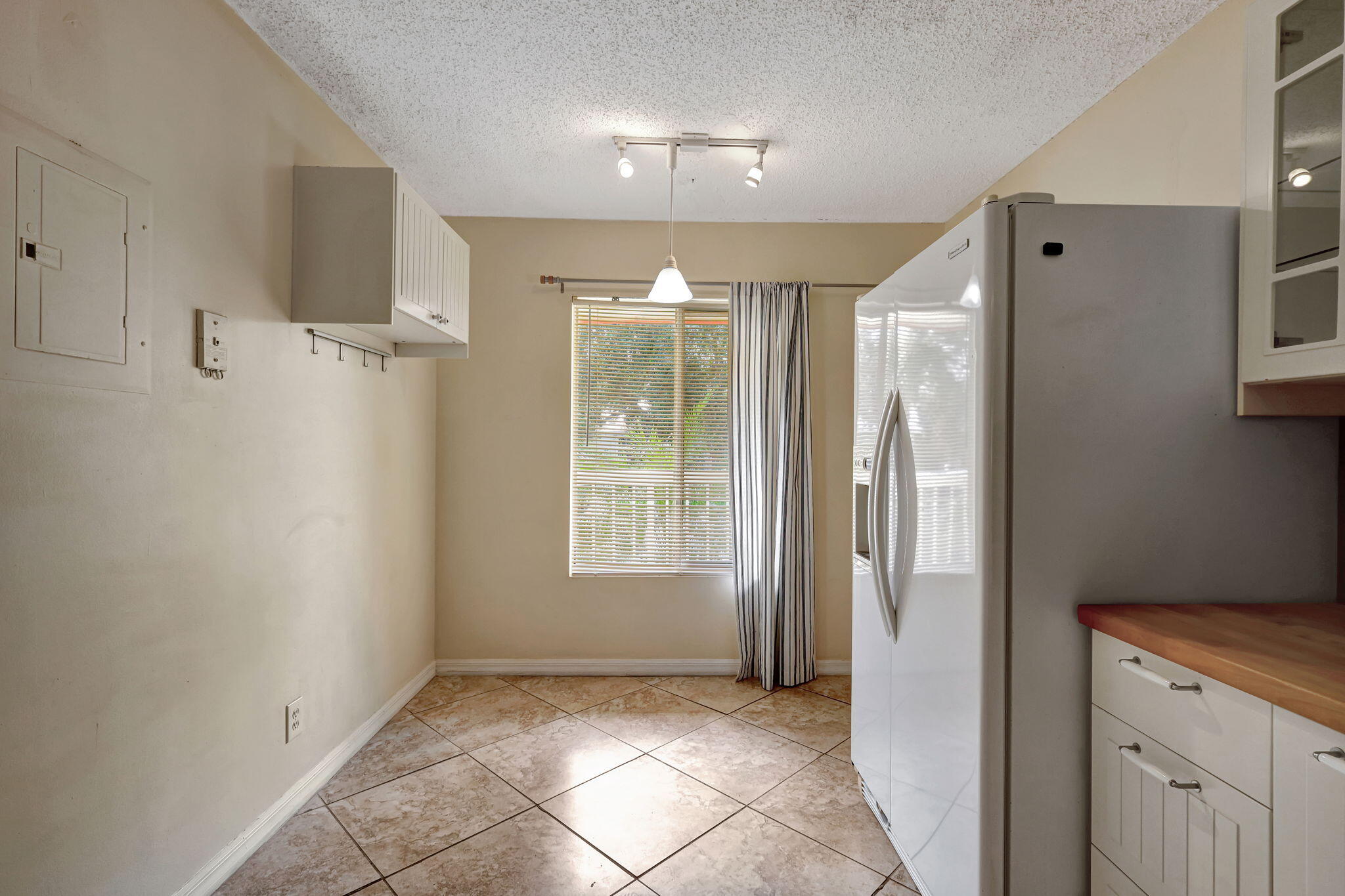 320 Northwest 67th Street, Unit C207 Boca Raton, FL 33487 - Photo 8 of 39 a view of an empty room with a window