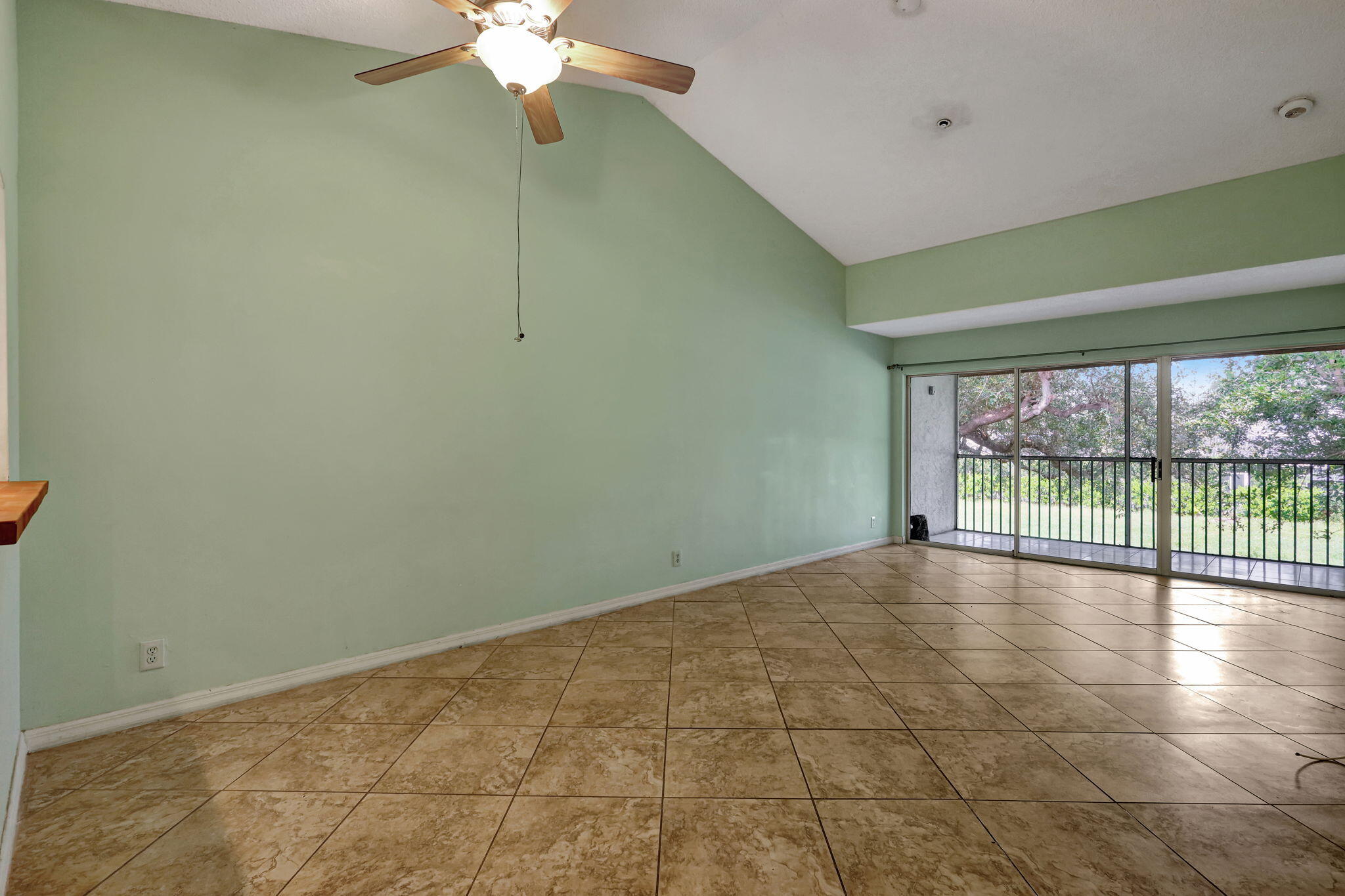 320 Northwest 67th Street, Unit C207 Boca Raton, FL 33487 - Photo 9 of 39 a view of an empty room with a window