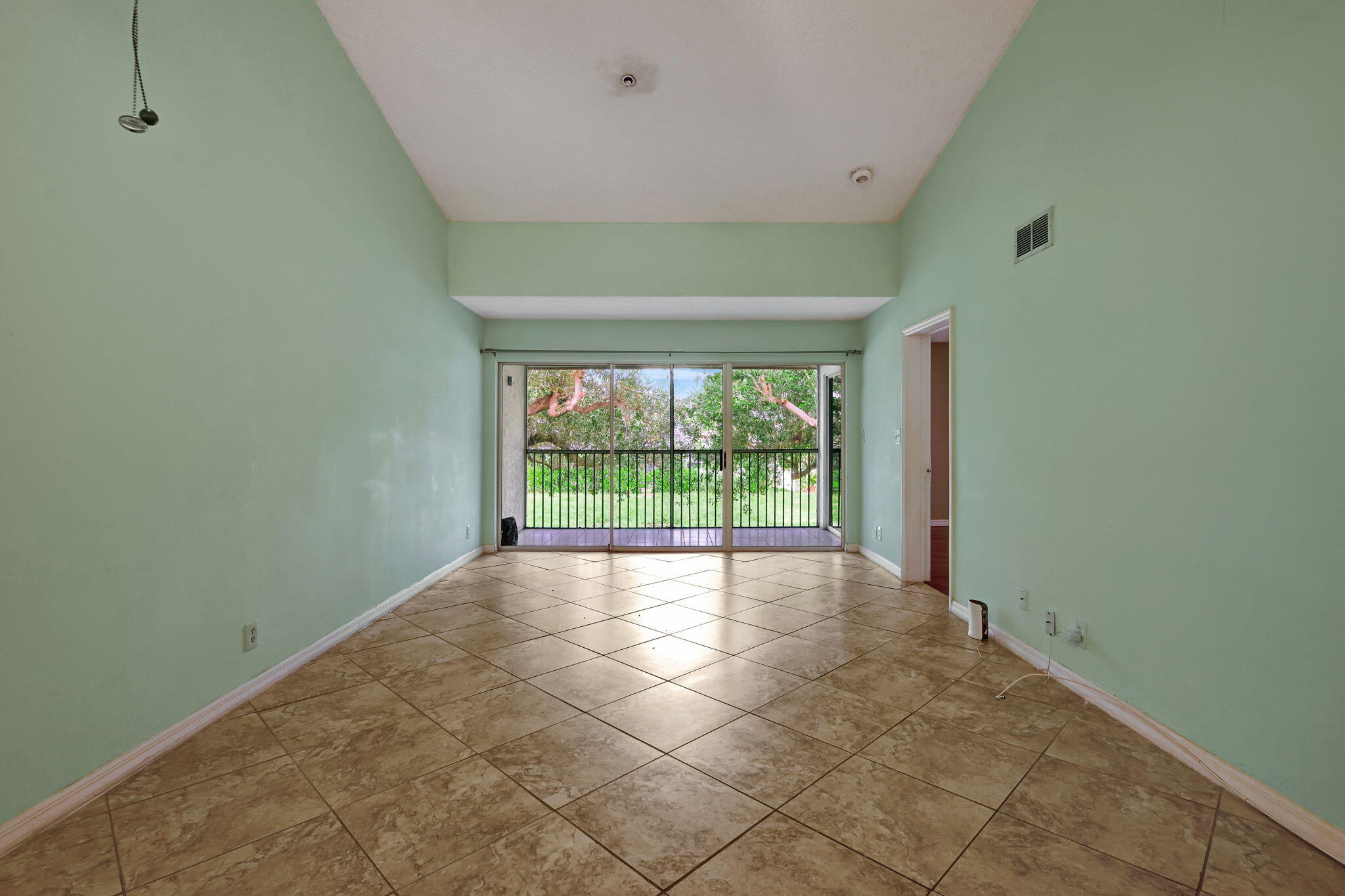 320 Northwest 67th Street, Unit C207 Boca Raton, FL 33487 - Photo 10 of 39 a view of an empty room with a window