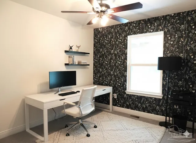 a workspace with furniture and window