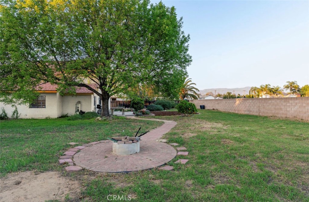 993 South Date Avenue Rialto, CA 92376 - Photo 16 of 27 a view of a house with backyard and trees