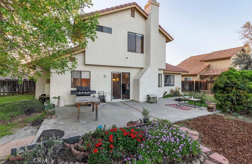 993 South Date Avenue Rialto, CA 92376 - Photo 19 of 27 a view of a house with backyard sitting area and garden