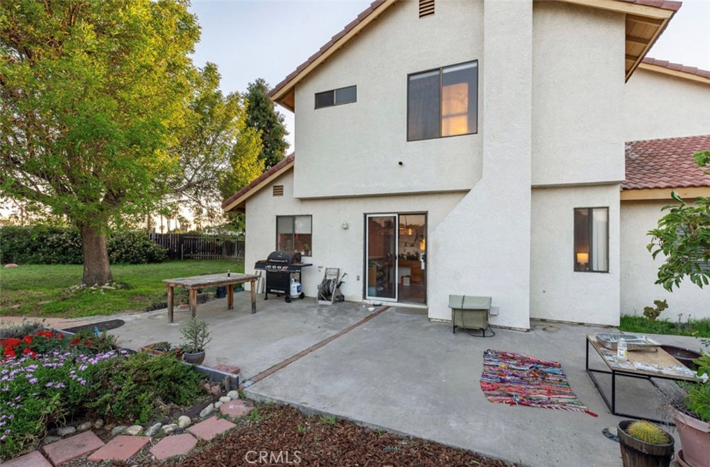 993 South Date Avenue Rialto, CA 92376 - Photo 20 of 27 a view of a house with backyard sitting area and garden