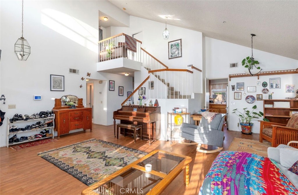 993 South Date Avenue Rialto, CA 92376 - Photo 25 of 27 a living room with lots of furniture and paintings on the wall