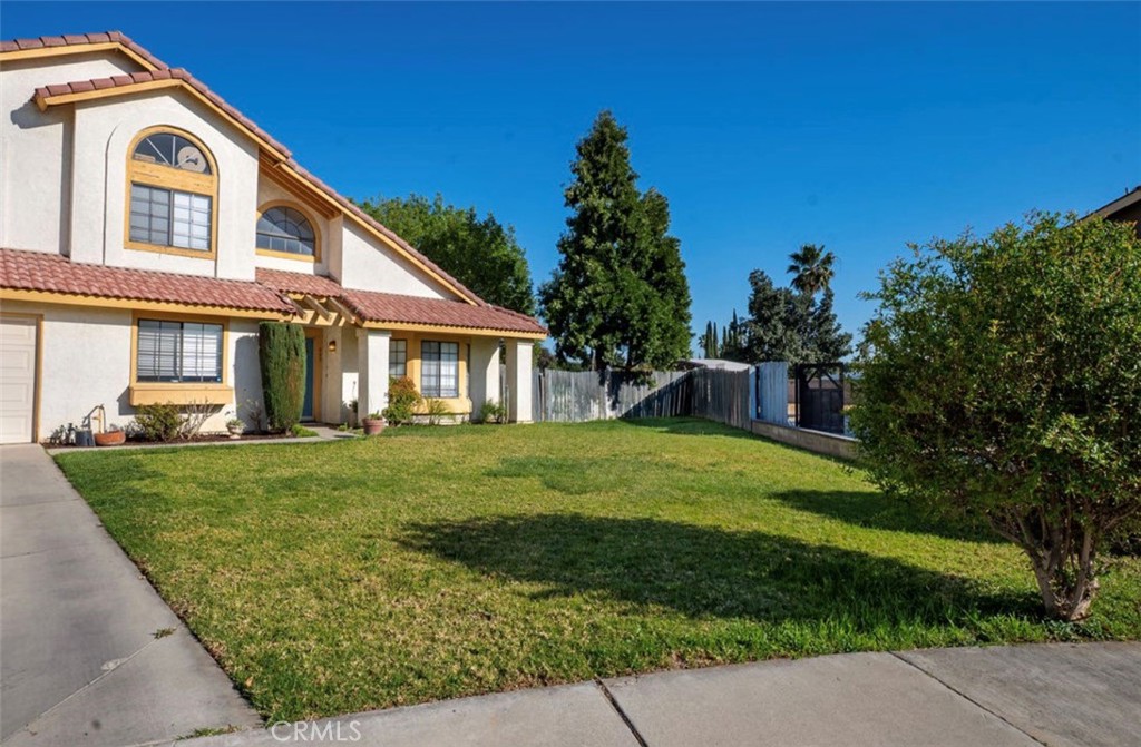 993 South Date Avenue Rialto, CA 92376 - Photo 3 of 27 a front view of a house with a yard