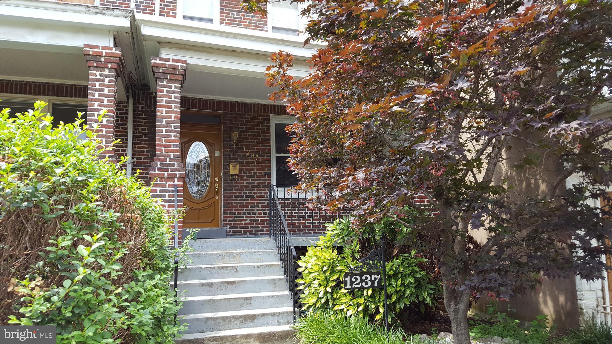 1237 Oates Street Northeast Washington, DC 20002 - Photo 2 of 15 a front view of a house with plants