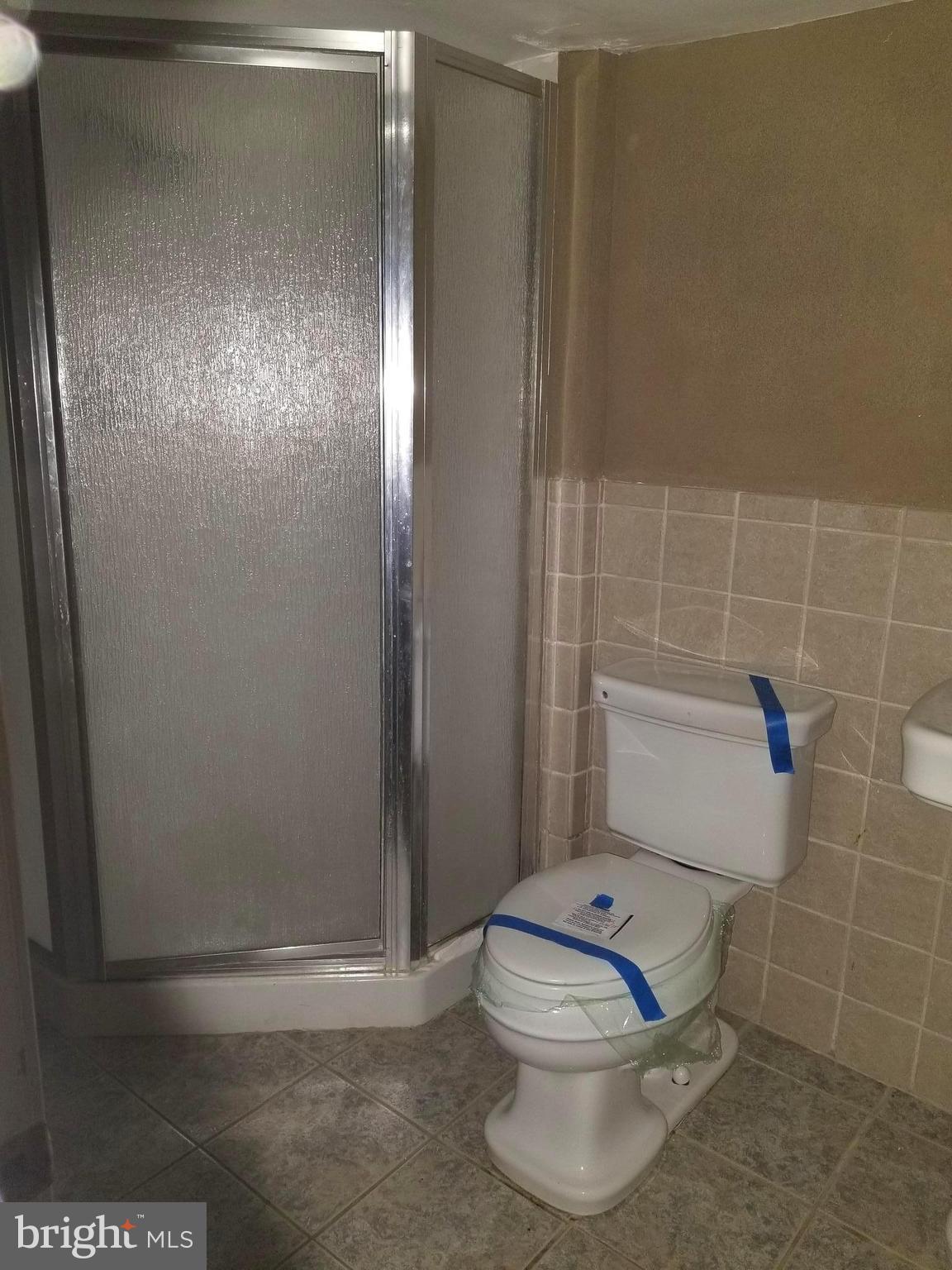 1237 Oates Street Northeast Washington, DC 20002 - Photo 12 of 15 a bathroom with a toilet and a shower