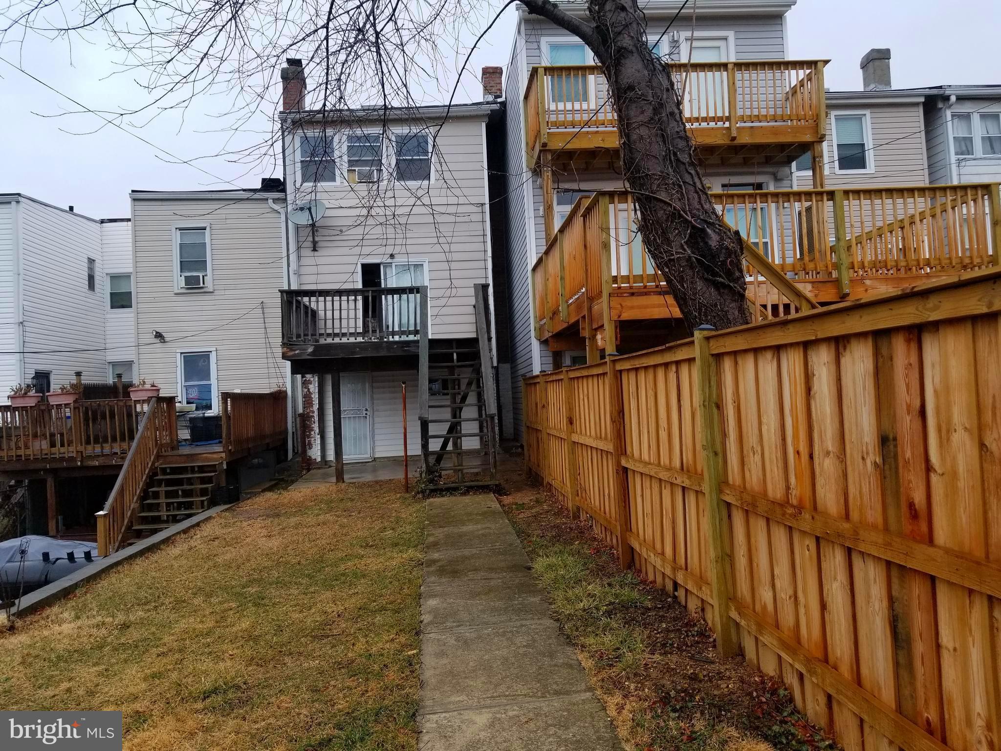 1237 Oates Street Northeast Washington, DC 20002 - Photo 15 of 15 a view of a house with wooden deck