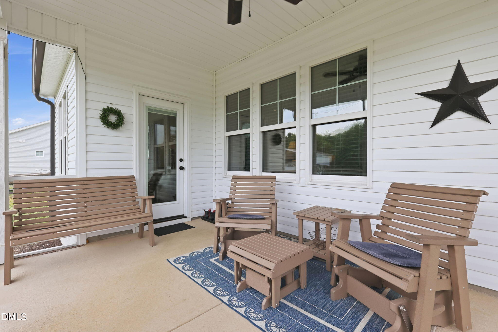 5098 Spring Hill Church Road Lillington, NC 27546 - Photo 30 of 36 a view of a patio with two chairs and a table