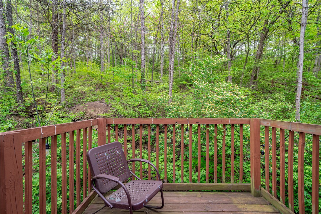 10584 New Biddinger Road Harrison, OH 45030 - Photo 46 of 61 This charming outdoor deck provides a serene escape surrounded by verdant trees.