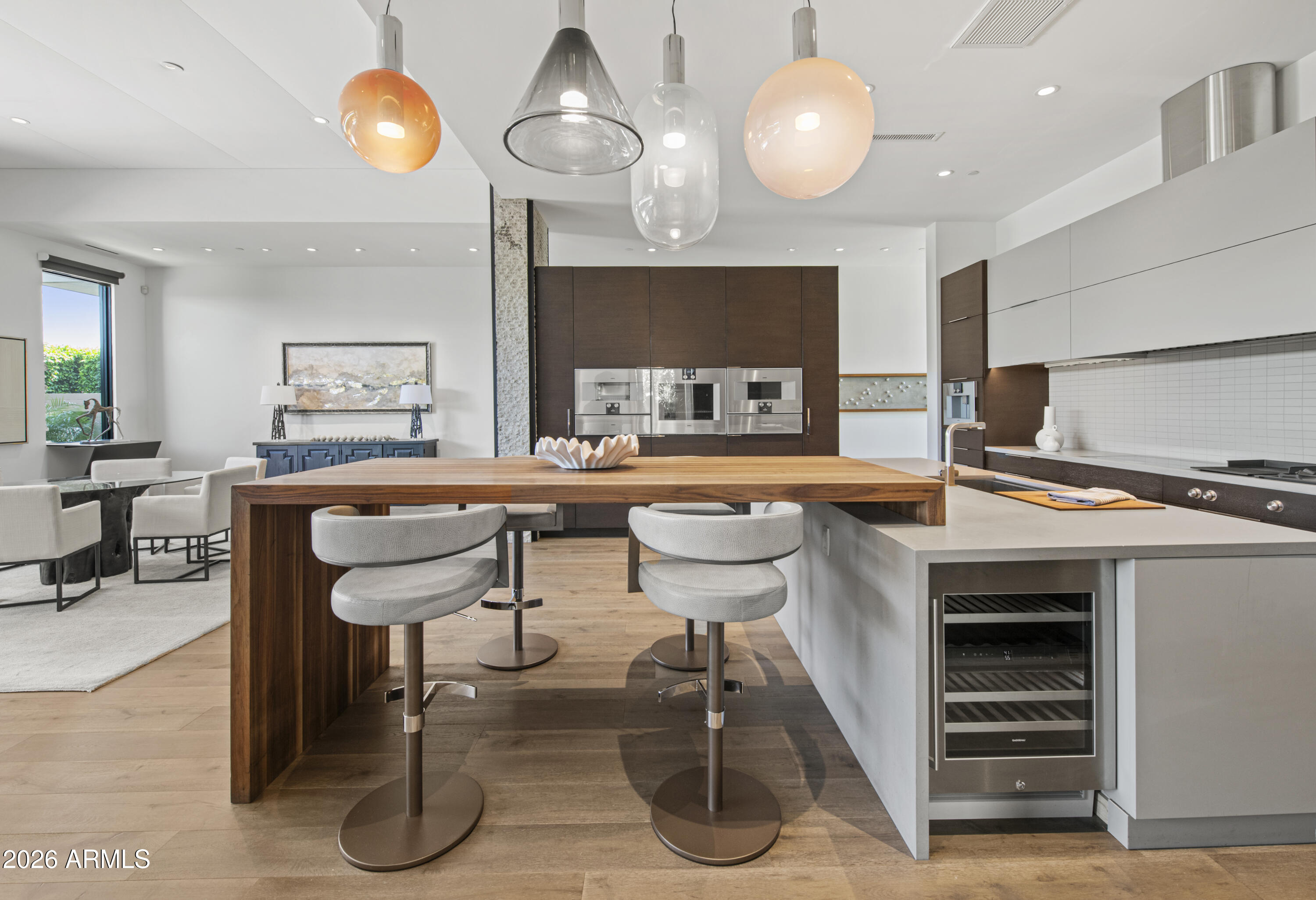 6982 East Joshua Tree Lane Paradise Valley, AZ 85253 - Photo 9 of 34 Waterfall Bar Seating and Wine Cooler