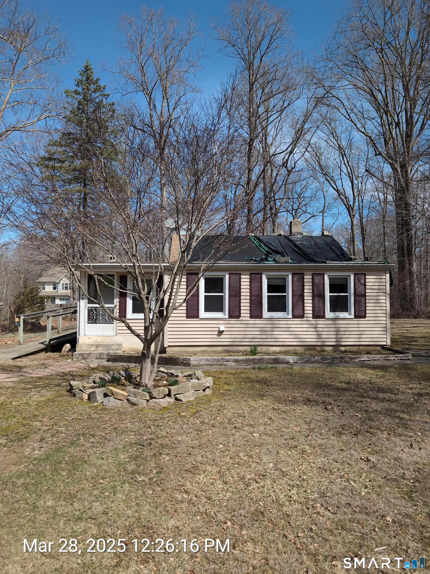 97 Bushy Hill Road Deep River, CT 06417 - Photo 2 of 28 a front view of a house with a yard