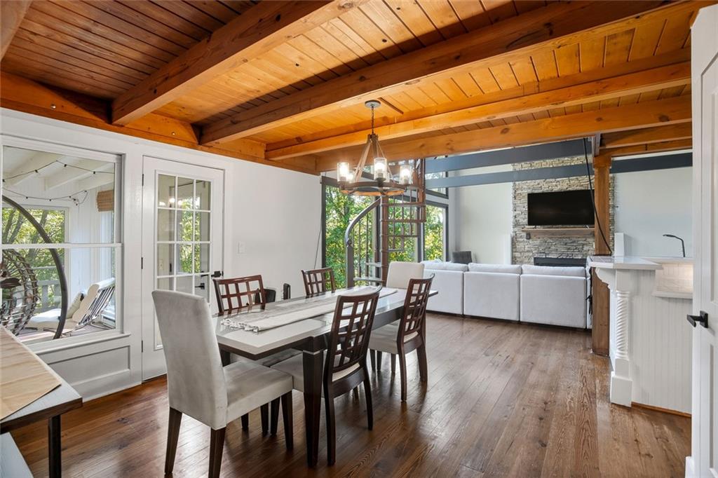 203 Wild Azalea Circle Jasper, GA 30143 - Photo 17 of 37 a dining room with furniture and wooden floor