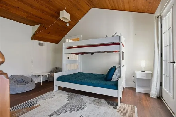 a bedroom with a bed and a view of bathroom