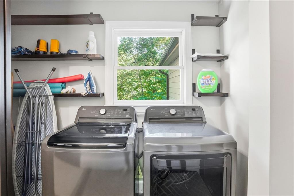 203 Wild Azalea Circle Jasper, GA 30143 - Photo 33 of 37 a view of washer and dryer with rug