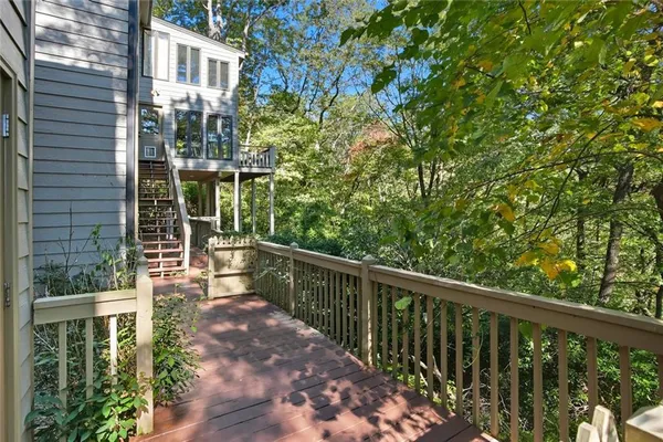 a view of a balcony with wooden floor