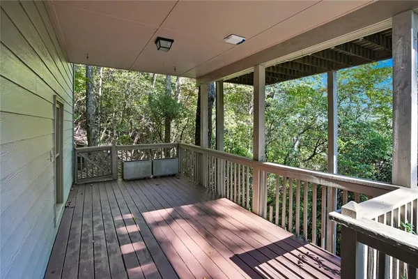 a view of a balcony with wooden floor