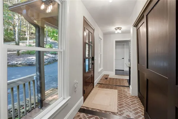a bathroom with a glass door shower and a sink