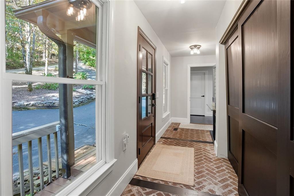 203 Wild Azalea Circle Jasper, GA 30143 - Photo 5 of 37 a bathroom with a glass door shower and a sink