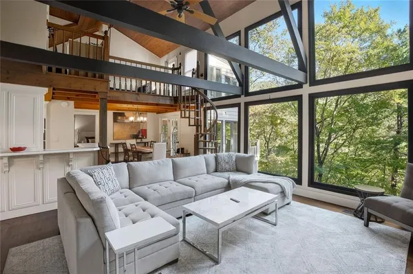 a living room with furniture and a large window