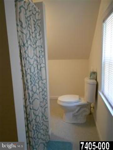 2100 Conewago Road Dover, PA 17315 - Photo 14 of 20 a bathroom with a toilet and a shower curtain