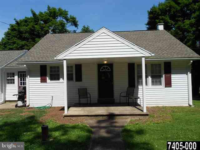 2100 Conewago Road Dover, PA 17315 - Photo 2 of 20 a view of small white house with yard and plants