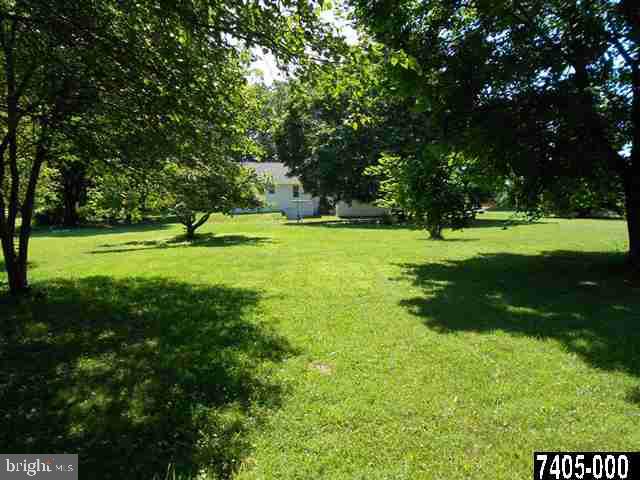 2100 Conewago Road Dover, PA 17315 - Photo 3 of 20 a view of a grassy field with trees in the background