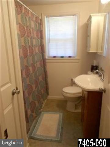 2100 Conewago Road Dover, PA 17315 - Photo 10 of 20 a bathroom with a sink a toilet and a mirror