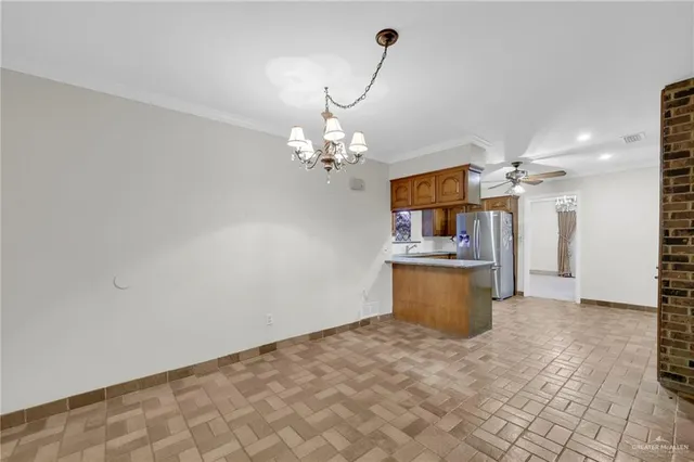 a view of a livingroom with furniture and a chandelier