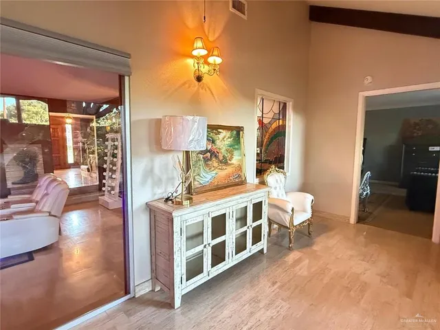 a living room with furniture fireplace and a fireplace