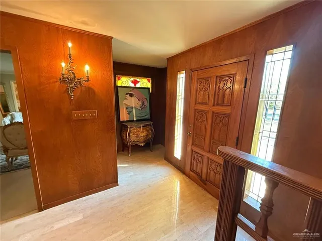 a room with lots of furniture and a large window