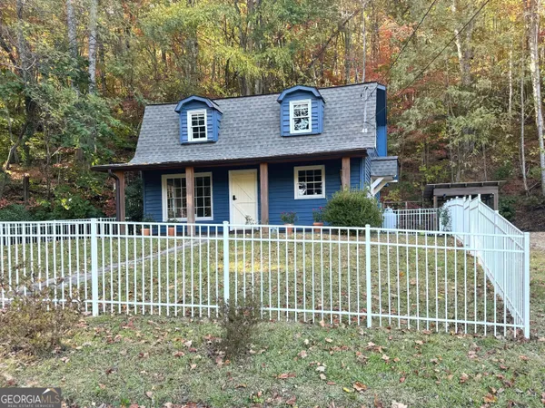 a view of a house with a small yard