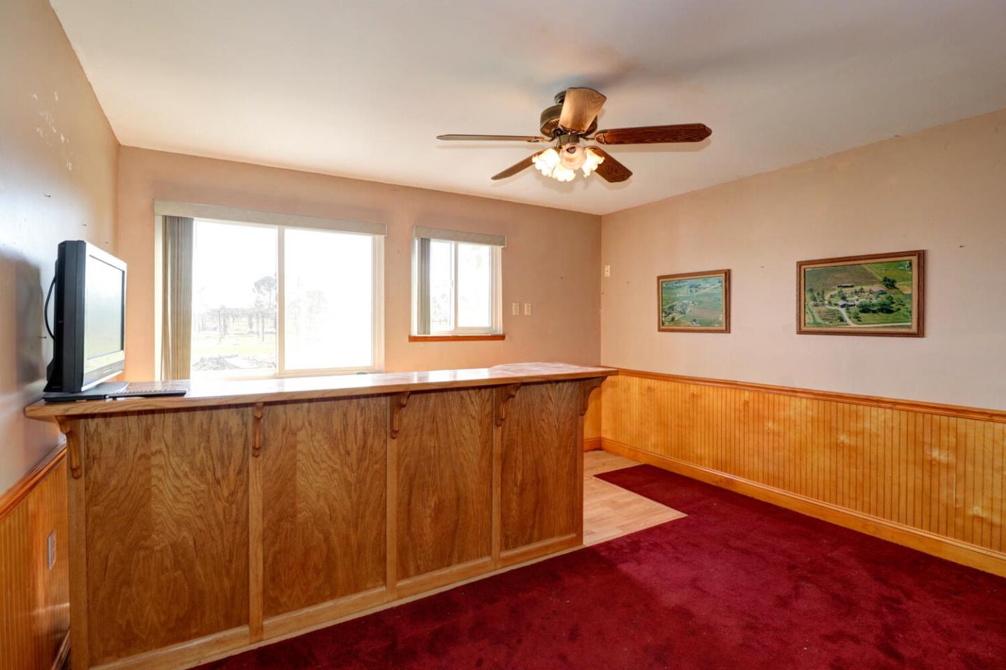 9809 Alta Mesa Road Wilton, CA 95693 - Photo 51 of 86 a view of an empty room with window and wooden floor