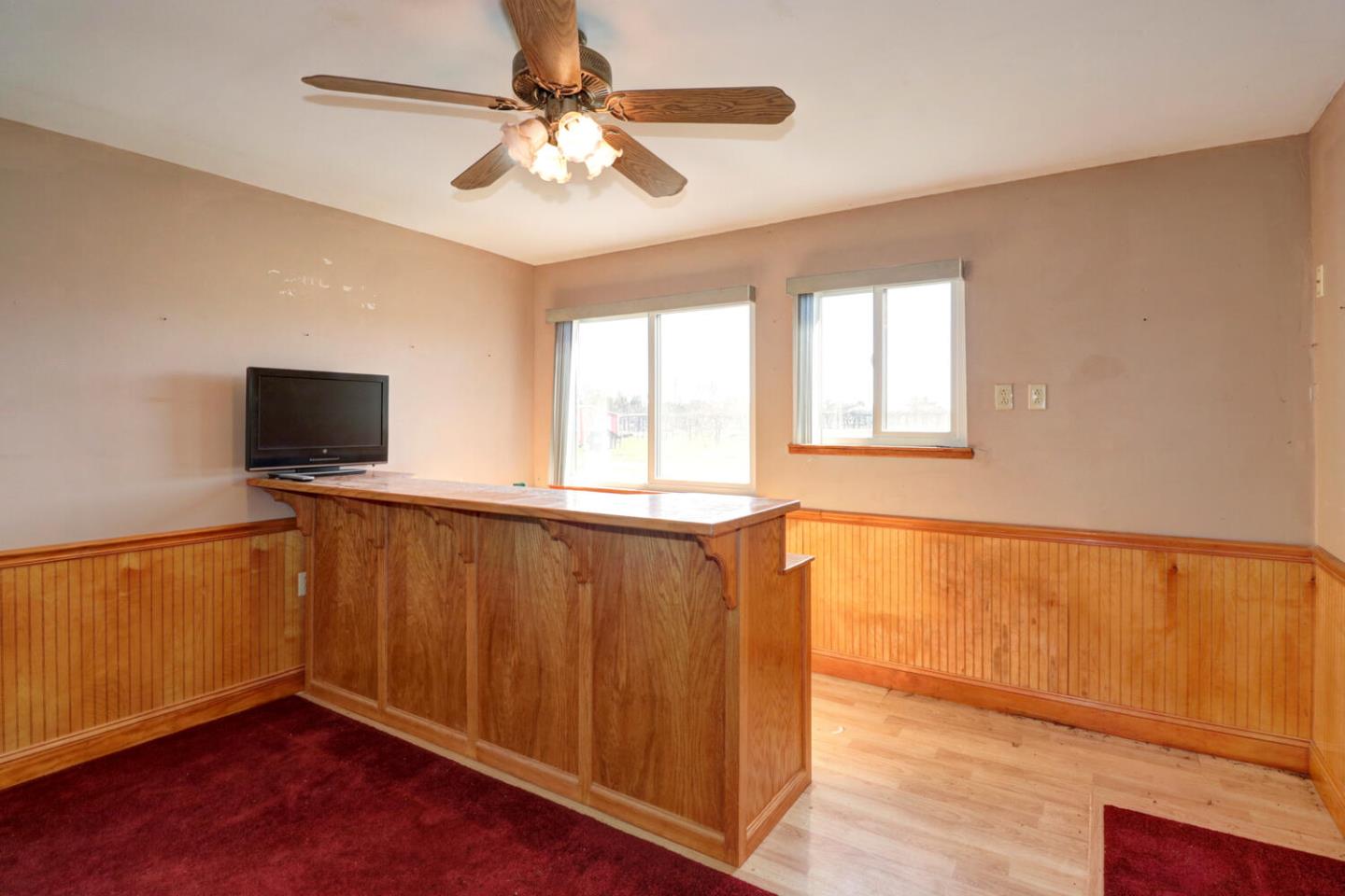 9809 Alta Mesa Road Wilton, CA 95693 - Photo 52 of 86 a view of an empty room with wooden floor and a window