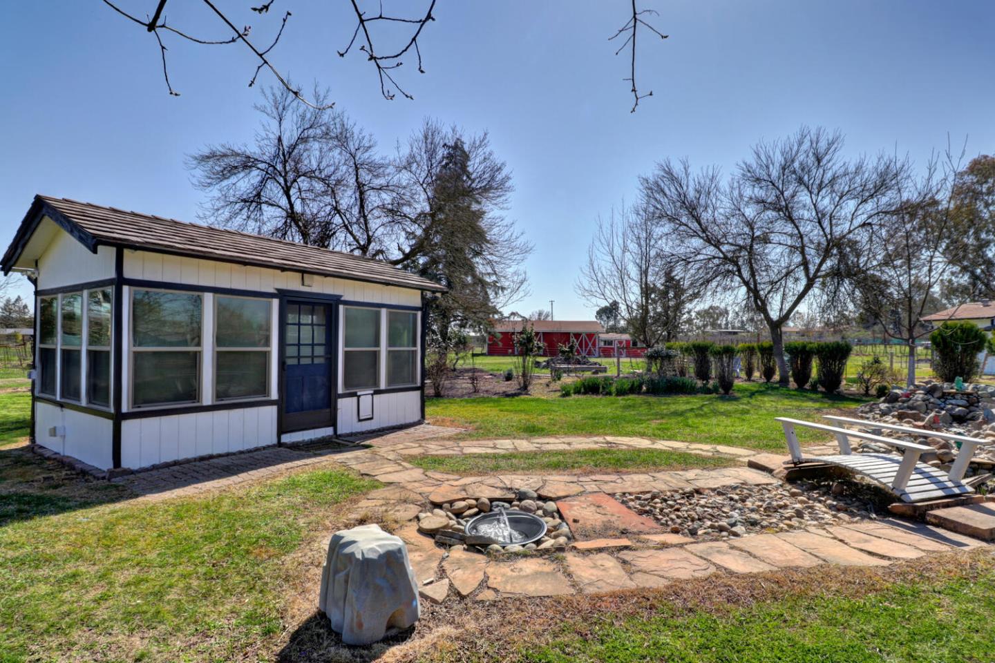 9809 Alta Mesa Road Wilton, CA 95693 - Photo 56 of 86 a view of a house with backyard and garden
