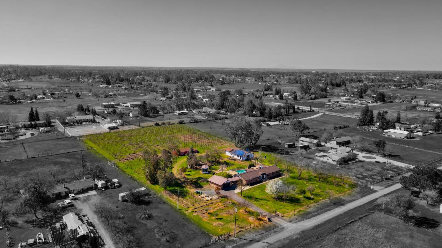 9809 Alta Mesa Road Wilton, CA 95693 - Photo 66 of 86 an aerial view of a house with a swimming pool