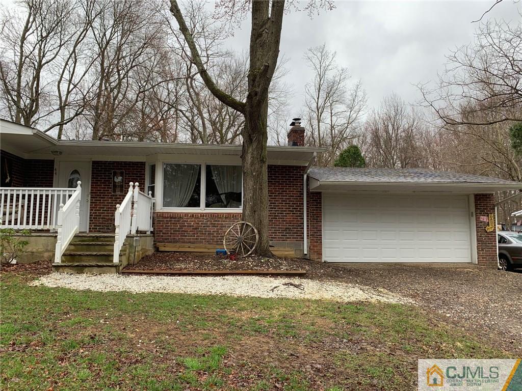 44 Pleasant Valley Road Old Bridge, NJ 08857 - Photo 1 of 14 a front view of a house with garden
