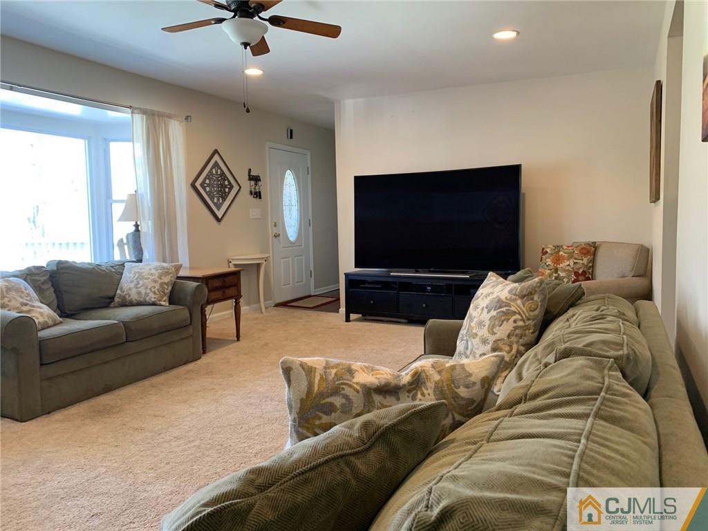 44 Pleasant Valley Road Old Bridge, NJ 08857 - Photo 3 of 14 a living room with furniture and a flat screen tv