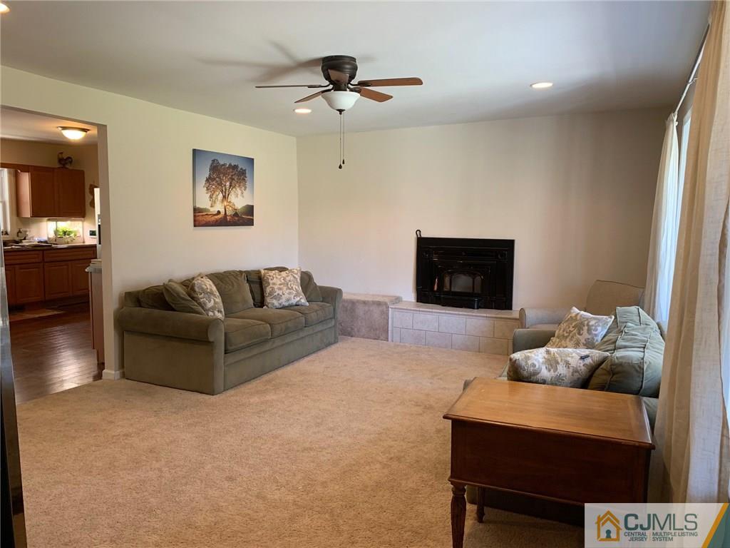 44 Pleasant Valley Road Old Bridge, NJ 08857 - Photo 4 of 14 a living room with furniture and a flat screen tv