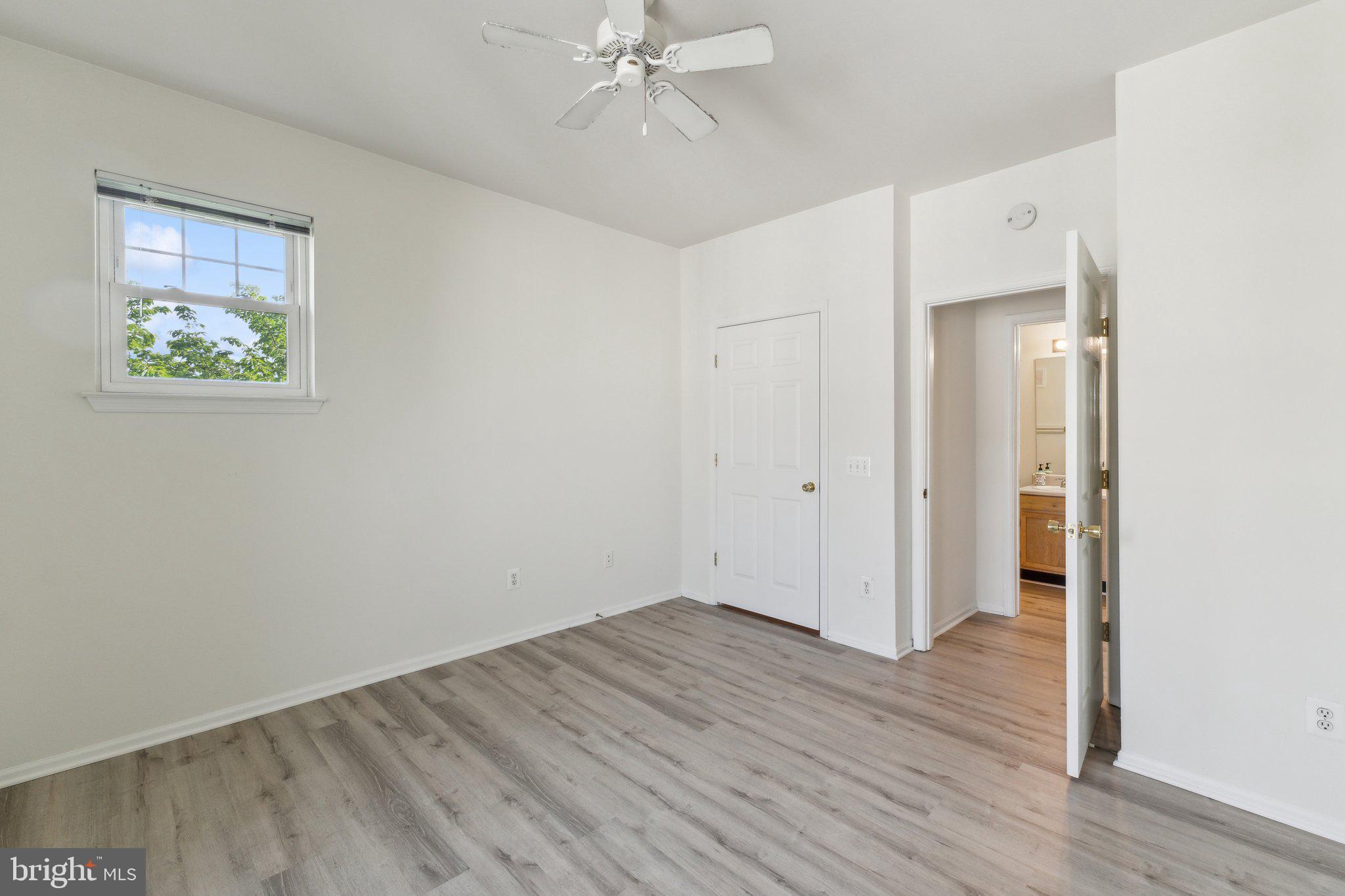 1591 Spring Gate Dr., Unit 3415 McLean, VA 22102 - Photo 12 of 20 a view of an empty room with wooden floor