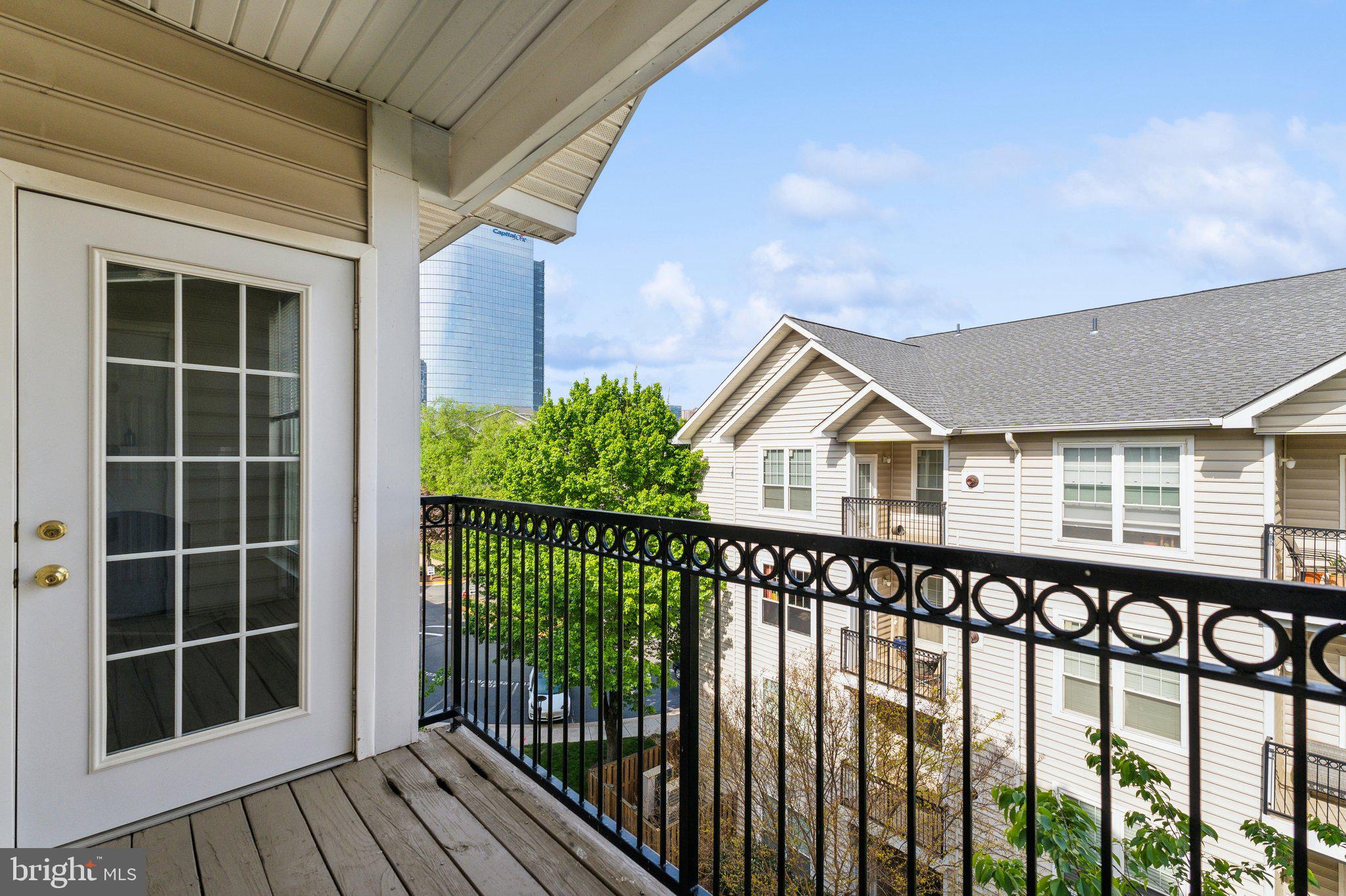 1591 Spring Gate Dr., Unit 3415 McLean, VA 22102 - Photo 19 of 20 a front view of a house with a porch