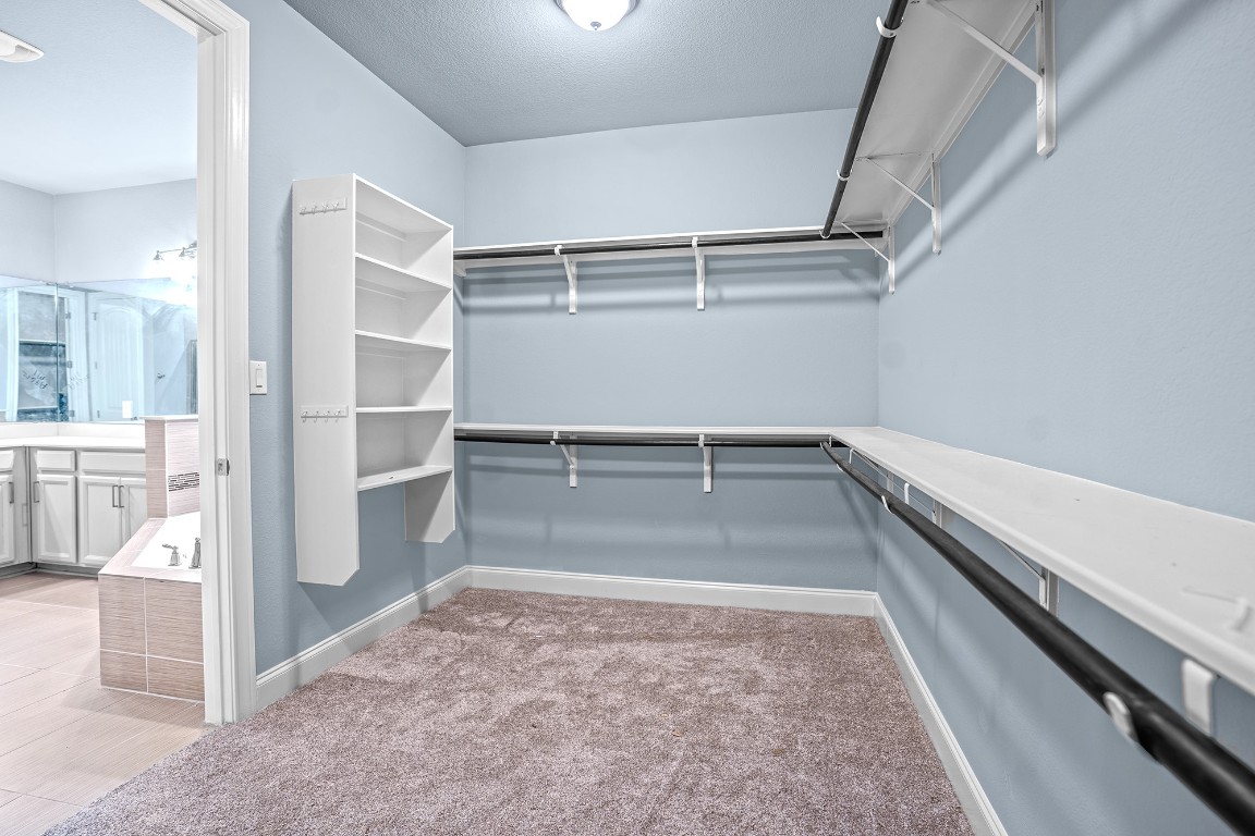 2328 Blended Tree Ranch Drive Leander, TX 78641 - Photo 16 of 30 a view of a walk in closet