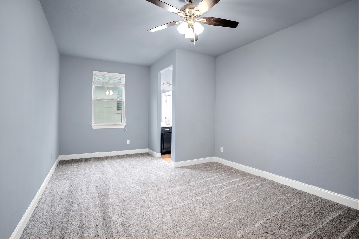 2328 Blended Tree Ranch Drive Leander, TX 78641 - Photo 22 of 30 wooden floor in an empty room with a window