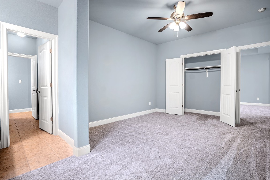 2328 Blended Tree Ranch Drive Leander, TX 78641 - Photo 23 of 30 a view of empty room with a ceiling fan