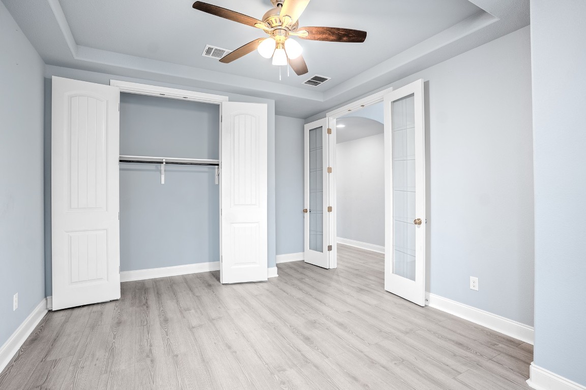 2328 Blended Tree Ranch Drive Leander, TX 78641 - Photo 5 of 30 a view of an empty room with wooden floor