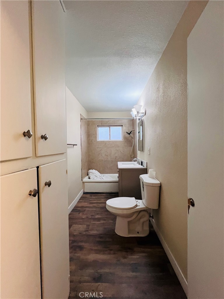 25346 Agate Road Barstow, CA 92311 - Photo 7 of 10 a bathroom with a toilet sink and mirror