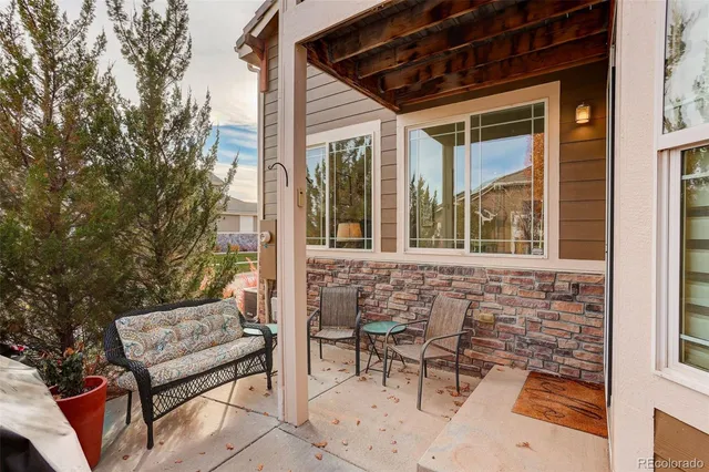 a view of a chair and table in the balcony