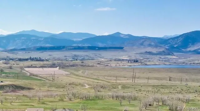 a view of ocean and mountain